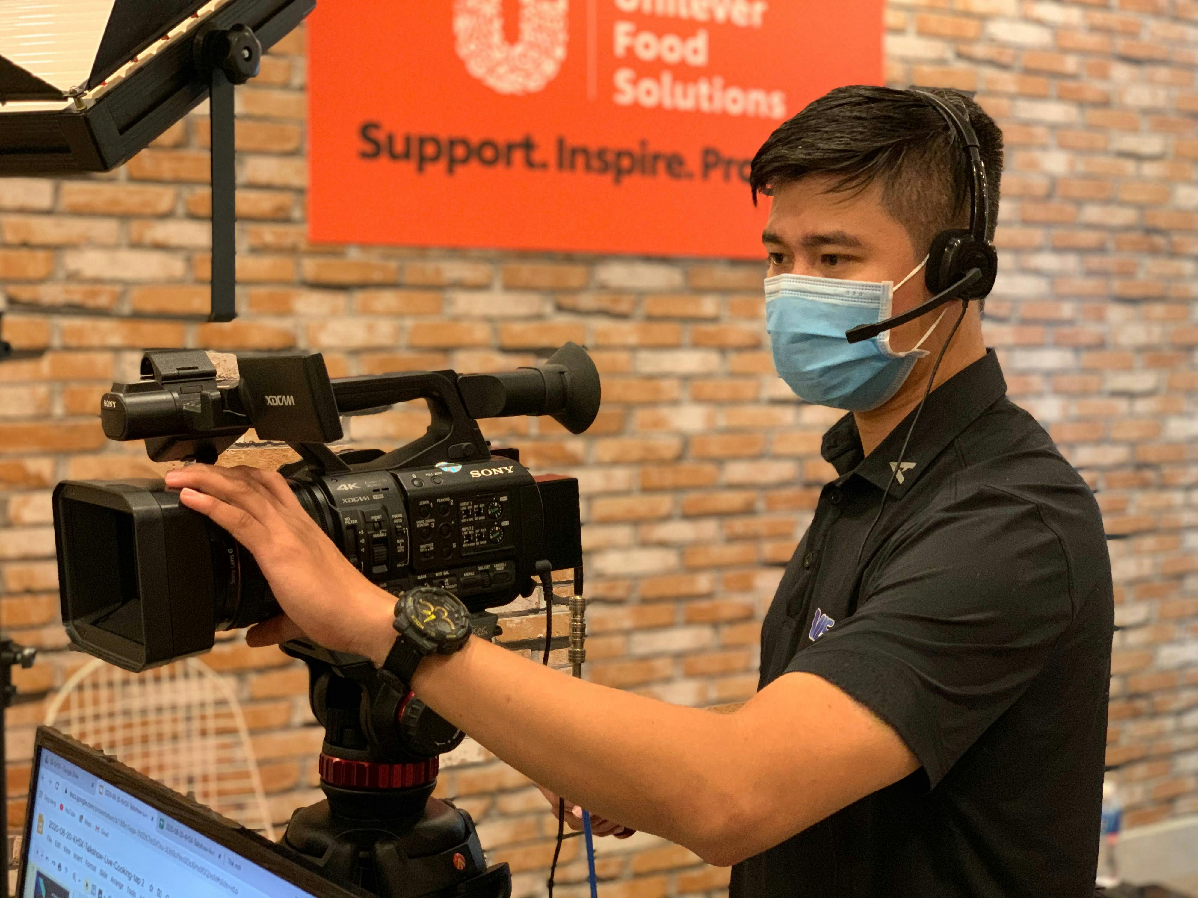 Professional video production camera setup in a studio environment with lighting equipment